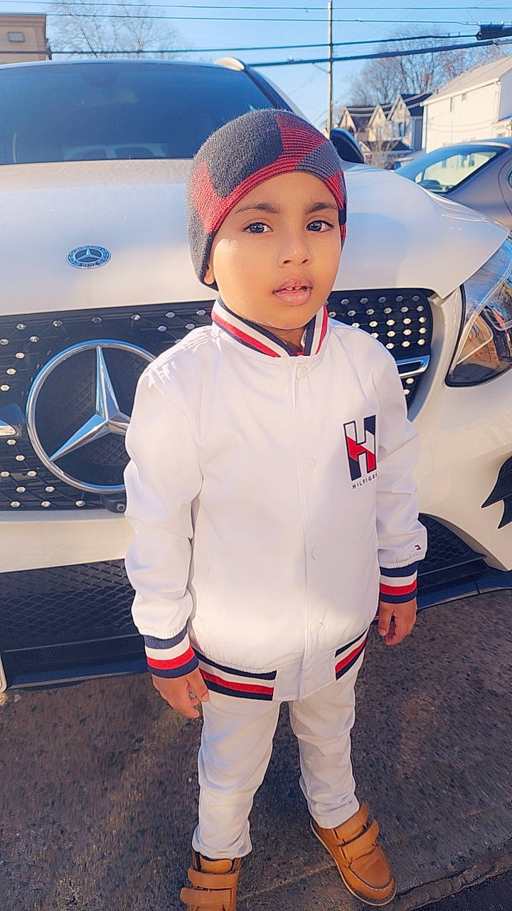 Dominick Jeonarine joined the competition — help win amazing prizes! auto_part, automotive_design, automotive_exterior, automotive_lighting, automotive_tire, automotive_wheel_system, bumper, car, electric_blue, family_car, gesture, hat, headwear, hood, motor_vehicle, person, personal_luxury_car, tire, toddler, vehicle