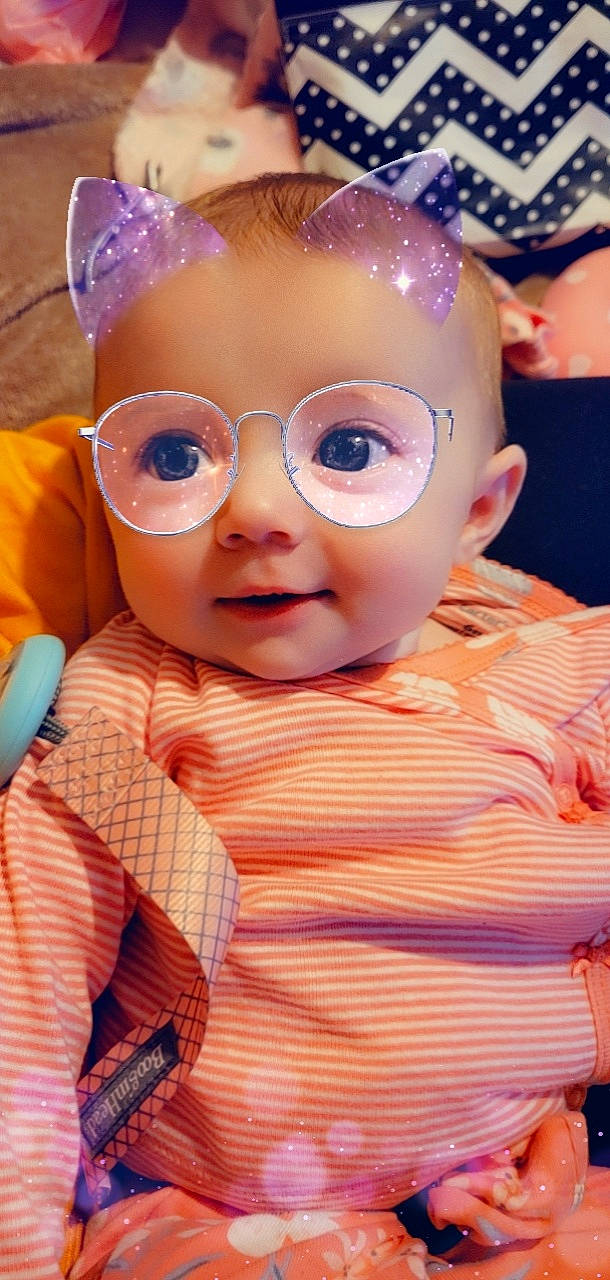 Bryleigh is registered to the contest to win money with this photo: baby, baby_toddler_clothing, cheek, eyelash, eyewear, fun, happy, head, headgear, iris, lip, mouth, nose, person, pink, skin, smile, textile, toddler, toy