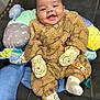 Romeo joined the competition — help win amazing prizes! baby, infant, smile, mittens, onesie, cushion, chair, plush, happy, cute, child, socks, pacifier, toy, indoor, portrait, soft, cozy, face, seated