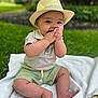 baby, child, hat, outdoor, grass, blanket, playful, cute, green_shorts, smiling, portrait, hands, feet, nature, daylight, sitting, young, person, hat_band, garden