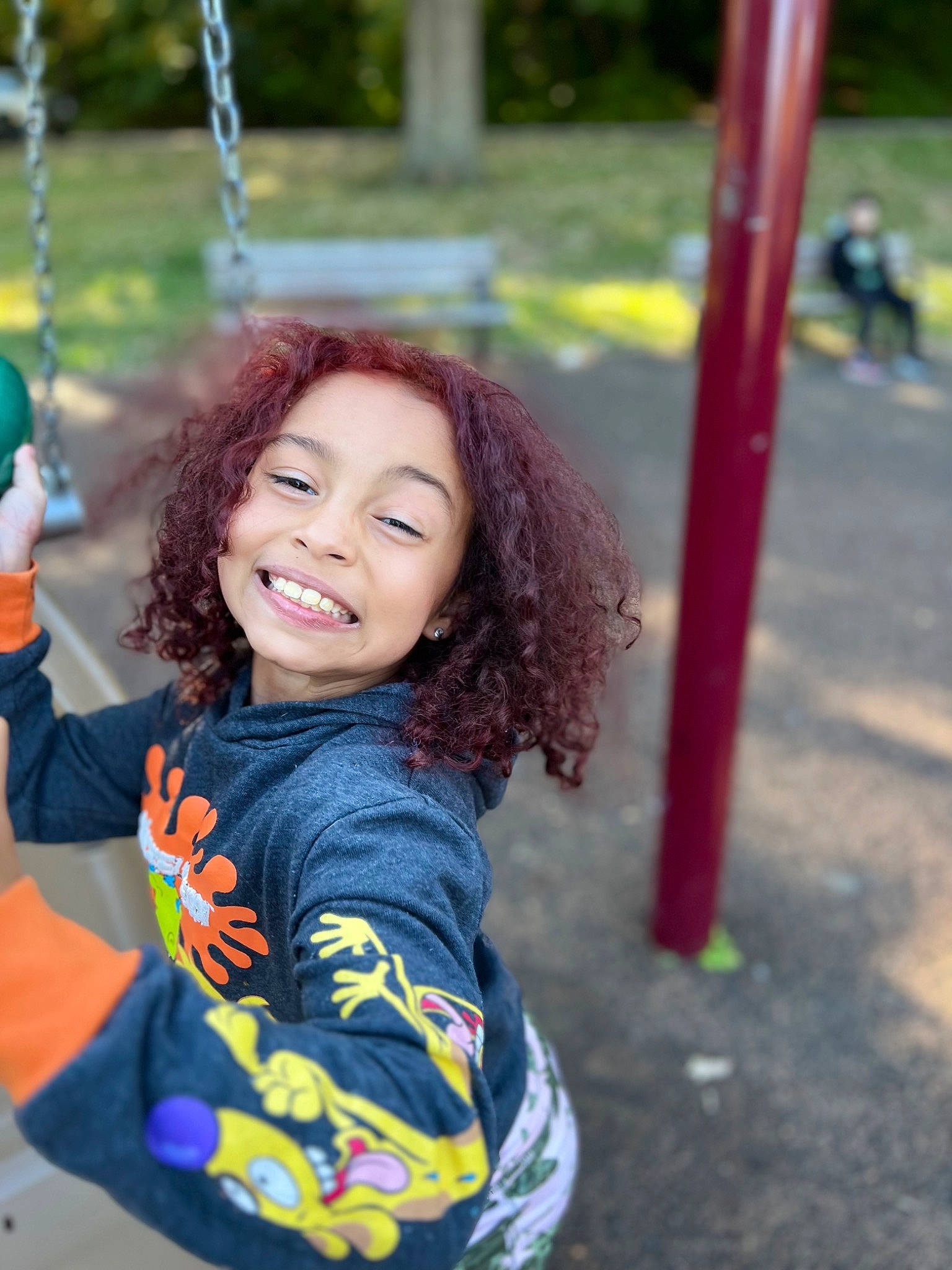 Penny joined the competition — help win amazing prizes! child, city, electric_blue, eye, flash_photography, fun, grass, happy, joy, leisure, long_hair, outdoor_play_equipment, person, playground, public_space, recreation, sitting, smile, summer, swing
