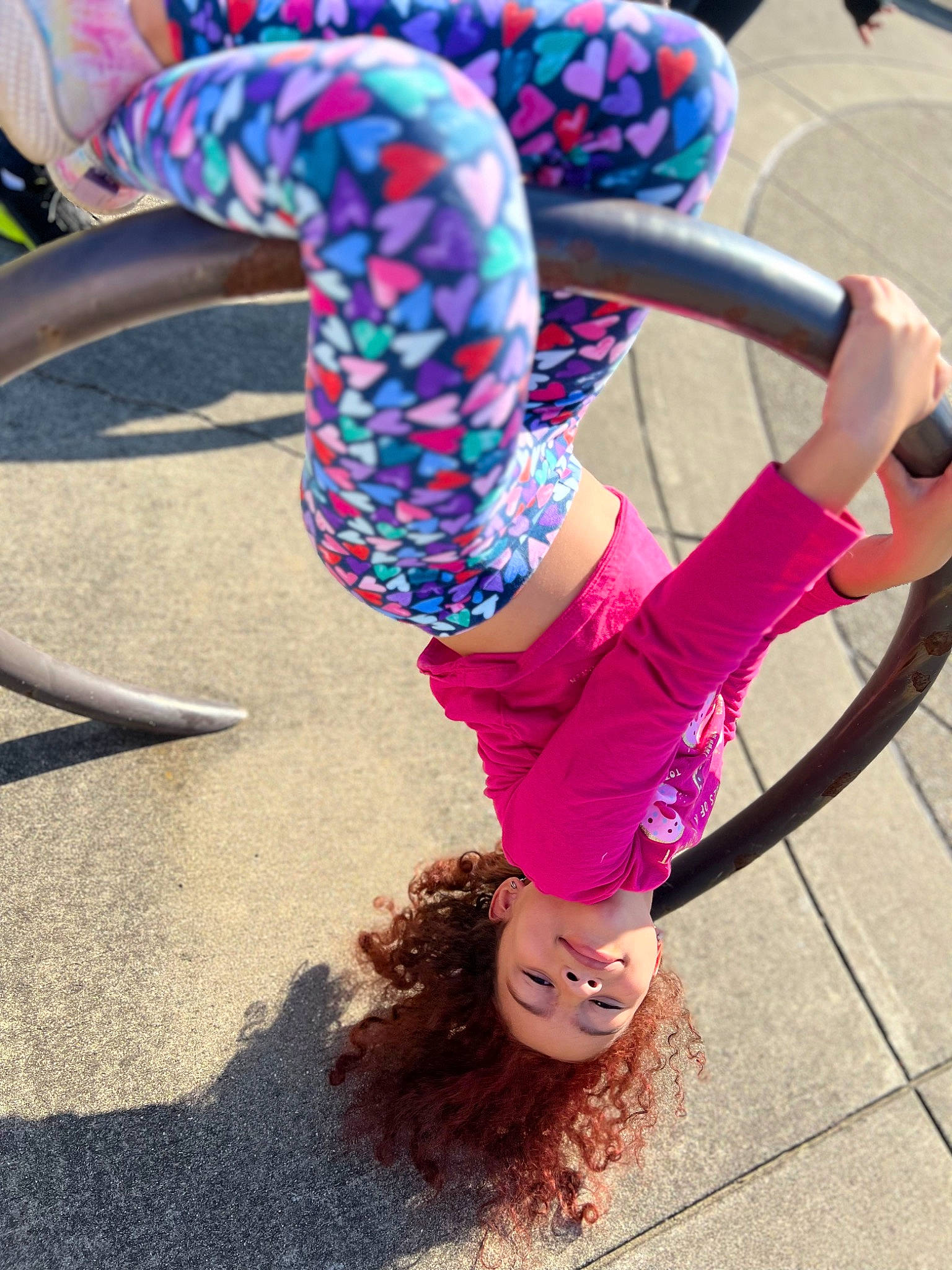 Penny is registered to the contest to win money with this photo: active_pants, electric_blue, entertainment, event, fashion_accessory, fun, grass, happy, human_leg, joy, knee, leisure, magenta, performing_arts, person, physical_fitness, pink, purple, sportswear, sunglasses