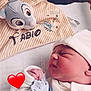 Fabio participe au concours pour gagner de l'argent avec cette photo : baby, blanket, closeup, clothing, cozy, cute, hat, heart_emoji, indoor, infant, name_embroidery, newborn, pacifier, peaceful, plush_toy, portrait, resting, sleeping, soft_lighting, striped_blanket