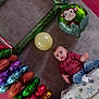 Fabio participe au concours pour gagner de l'argent avec cette photo : toddler, child, balloon, monkey_balloon, yellow_balloon, blanket, star_pattern, jeans, maroon_shirt, indoor, floor, colorful, party_decorations, celebration, curious_expression, toy, couch, home, relaxed, playful