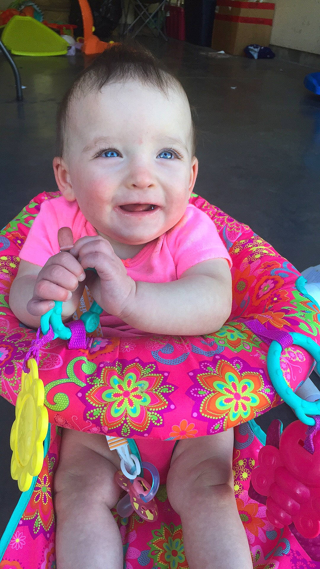 Lily is registered to the contest to win money with this photo: baby, baby_products, baby_toddler_clothing, cheek, child, finger, iris, magenta, person, pink, play, skin, smile, toddler