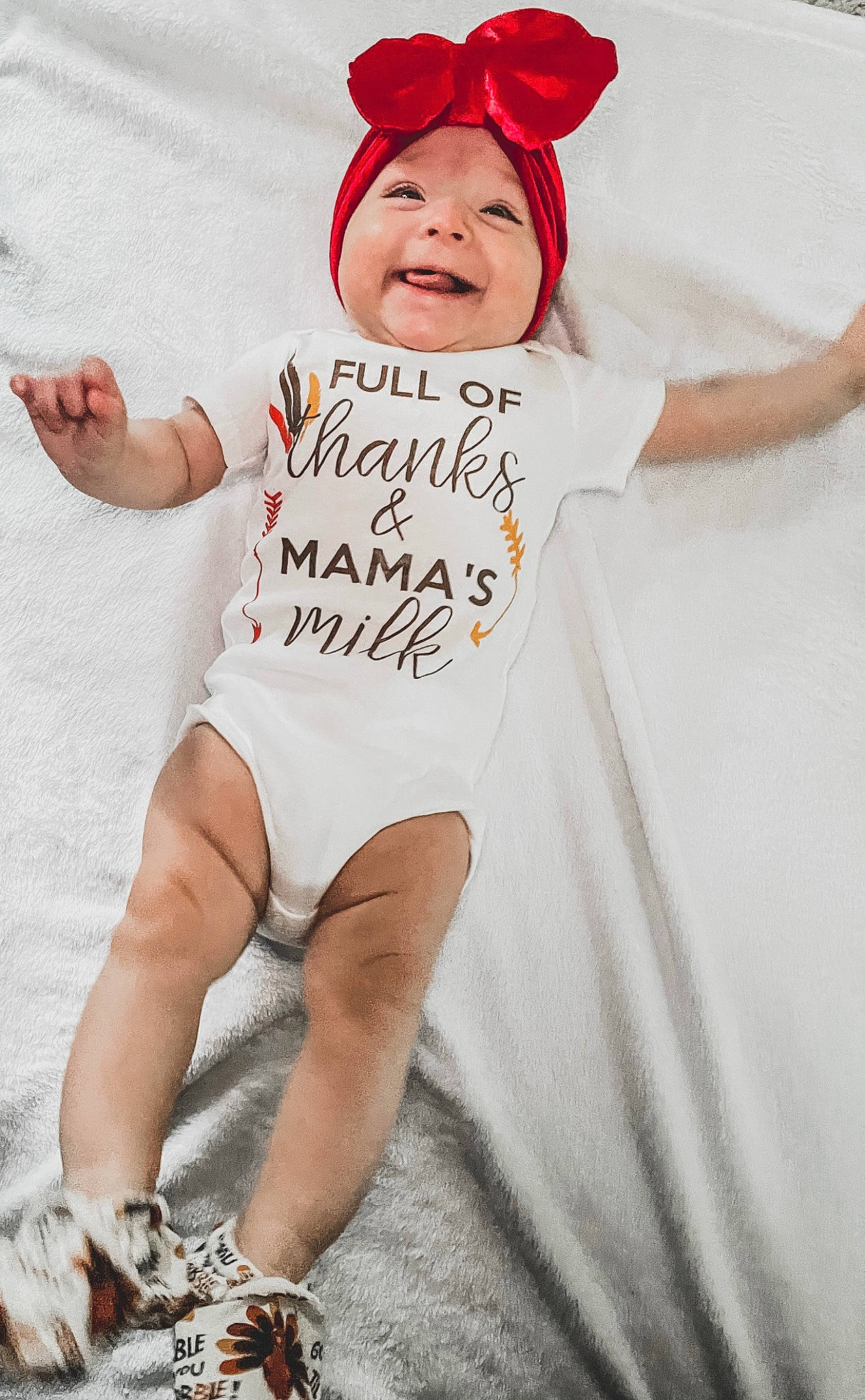 Raegan joined the competition — help win amazing prizes! arm, baby, baby_toddler_clothing, cap, cool, costume_hat, gesture, happy, head, headgear, headwear, human_body, human_leg, joy, leg, person, pink, sleeve, smile, t_shirt