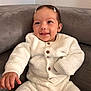 Victoire participe au concours pour gagner de l'argent avec cette photo : baby, smile, white_outfit, hair_clips, couch, soft_fabric, indoor, child, cute, happy, portrait, sitting, infant, cozy, buttoned_sweater, long_sleeves, comfortable, furniture, face, skin
