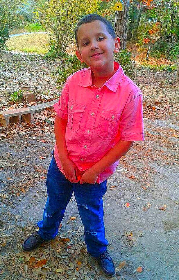 Chris is registered to the contest to win money with this photo: child, human_positions, joy, male, people, person, play, sitting, toddler