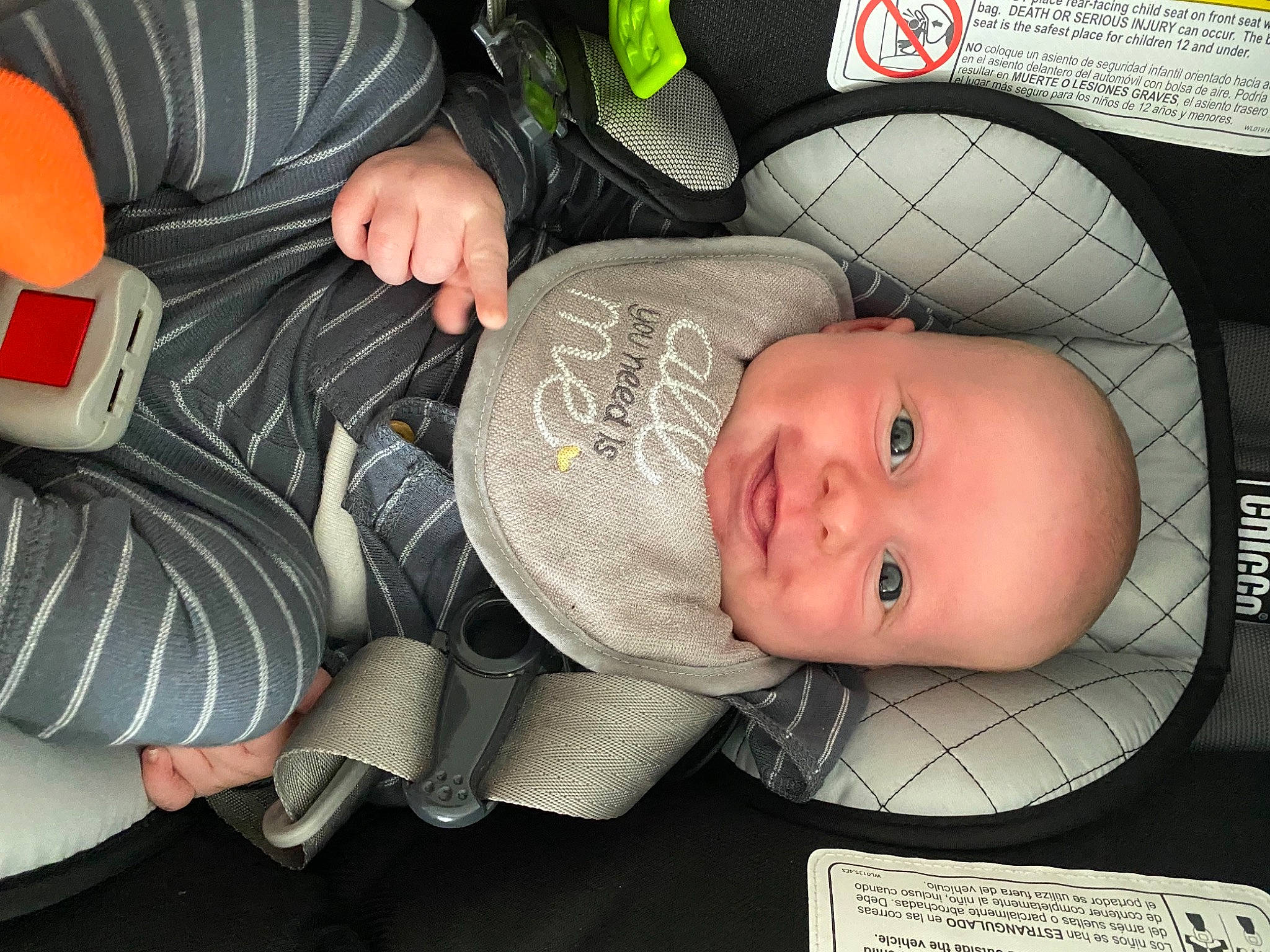 Tripp is registered to the contest to win money with this photo: baby, baby_carriage, baby_products, baby_safety, baby_toddler_clothing, car_seat, carmine, cheek, child, comfort, facial_expression, hairstyle, headgear, human_body, lap, mouth, person, room, sitting, smile