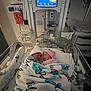 newborn, baby, incubator, hospital, blanket, medical_equipment, nursery, sleeping, hat, turtle_pattern, twins, bed, monitor, healthcare, indoors, cute, infant, person, sleep, cozy