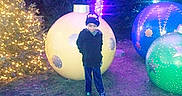 Grayson is registered to the contest to win money with this photo: balloon, blue, fun, light, party_supply, purple, recreation, tree, water, world