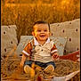 baby, child, smiling, outdoor, blanket, pillow, field, grass, golden_hour, autumn, cute, portrait, sitting, warm_light, nature, jeans, shirt, happy, infant, cozy