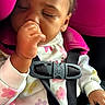 Juanita is registered to the contest to win money with this photo: baby, car_seat, casual, child, clothing, cute, floral_pattern, hair_buns, indoors, pink, portrait, relaxed, resting, safety_harness, seatbelt, sippy_cup, sleeping, thumb_sucking, toddler, young_child