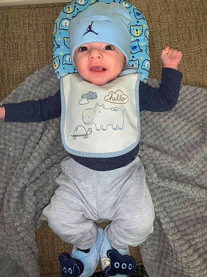 Noel is registered to the contest to win money with this photo: baby, baby_toddler_clothing, child, headwear, hoodie, person, sleeve, toddler