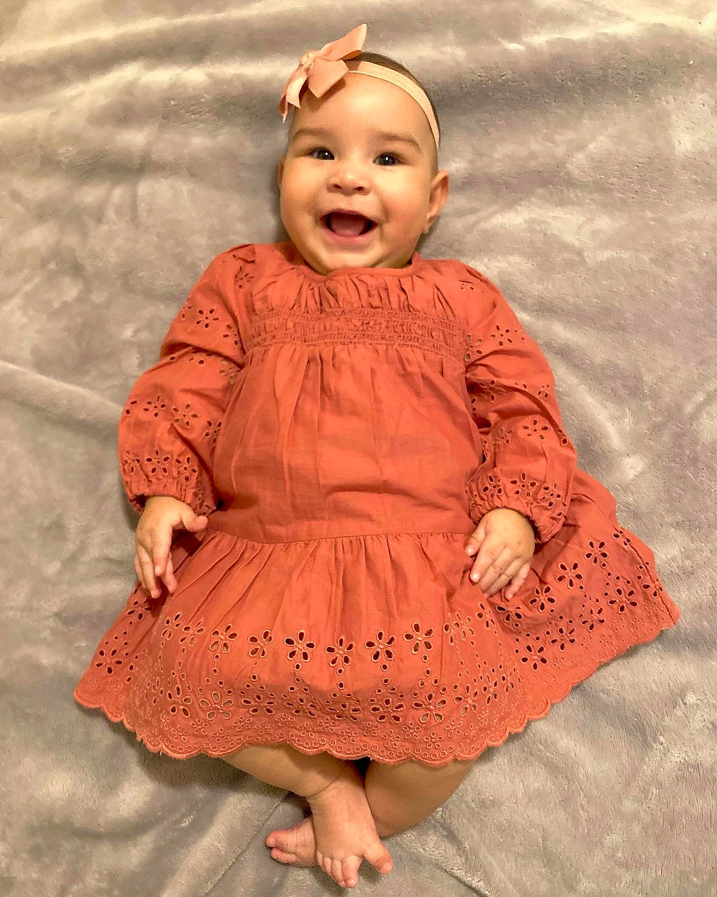 Leila is registered to the contest to win money with this photo: baby, baby_toddler_clothing, beauty, day_dress, dress, eye, face, happy, head, headgear, headwear, human_leg, joy, magenta, one_piece_garment, pattern, peach, person, pink, skin