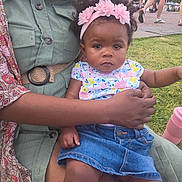 Yalonda is registered to the contest to win money with this photo: adult, baby, casual_clothing, child, colorful_clothing, cup, denim_skirt, flower_headband, grass, hand, headwear, lap, outdoor, park, people, pink, portrait, sitting, summer, walking