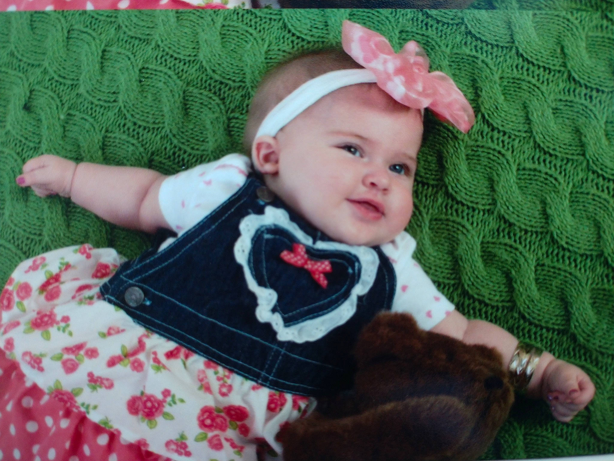 Lucille is registered to the contest to win money with this photo: baby, baby_products, baby_toddler_clothing, cheek, child, ear, fashion_accessory, hair_accessory, head, headband, headgear, pattern, person, pink, plant, product, sleeve, toddler