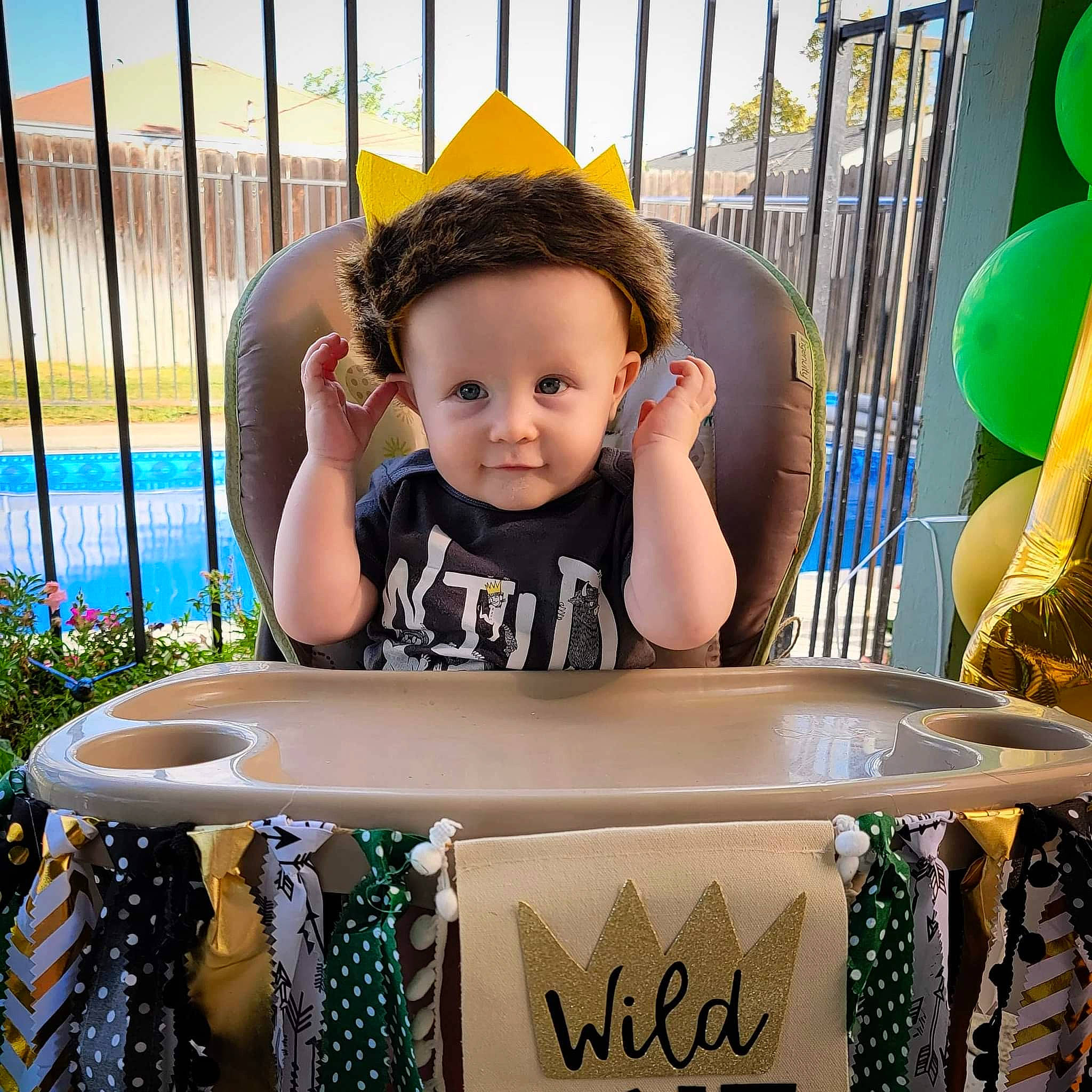 Finley joined the competition — help win amazing prizes! baby, baby_toddler_clothing, balloon, blue, child, event, fun, green, happy, leisure, person, plant, product, sitting, sky, smile, t_shirt, table, toddler, water
