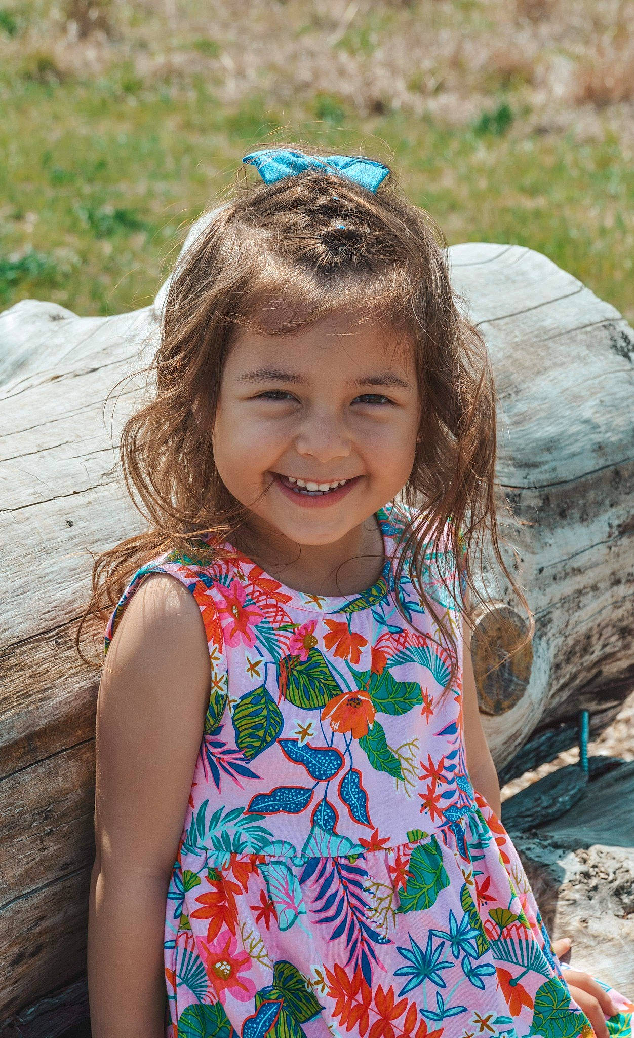 Sophia is registered to the contest to win money with this photo: azure, blue, body_of_water, botany, eye, grass, green, happy, head, human_body, iris, joy, leisure, organ, people_in_nature, person, photograph, pink, skin, smile