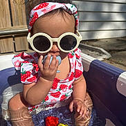 Raylynn joined the competition — help win amazing prizes! toddler, child, sunglasses, swimsuit, water, pool, toy, chewing, summer, outdoor, sunlight, headband, strawberry_pattern, baby, sitting, playtime, plastic_toy, skin, fun, sunny_day