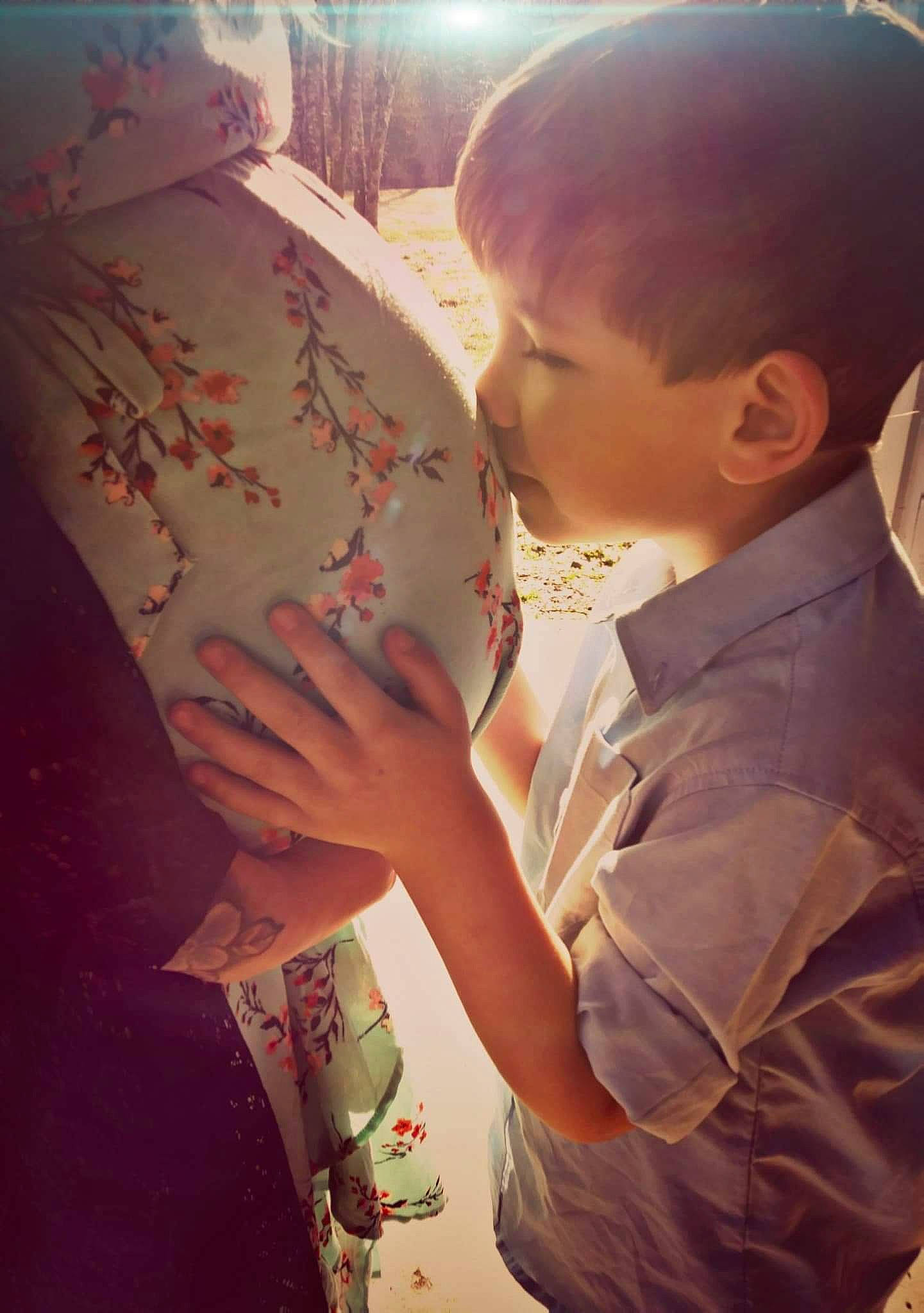 Cain is registered to the contest to win money with this photo: arm, child, finger, gesture, hand, interaction, person, toddler, world