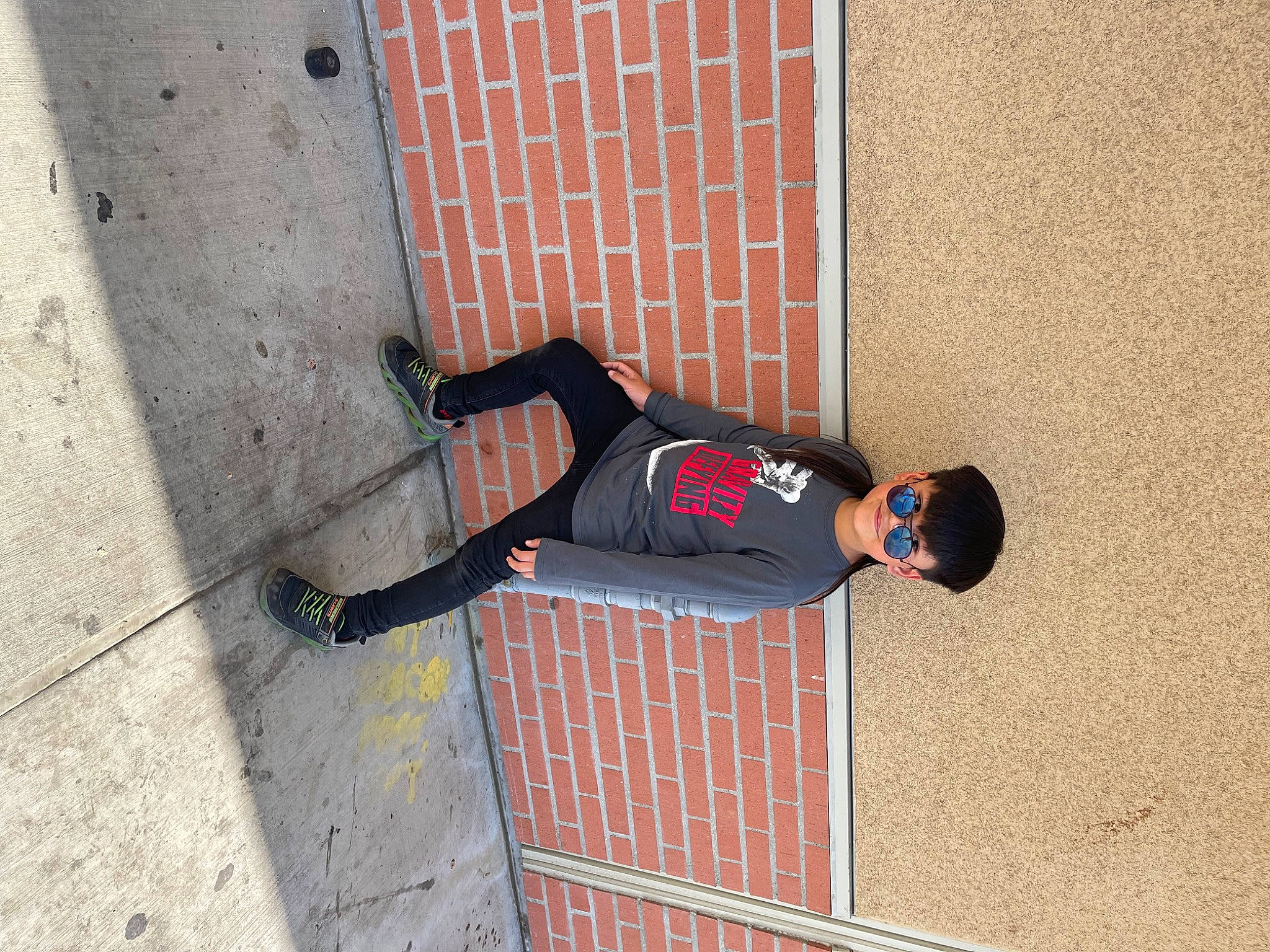 Chris Trevor Dela Cruz joined the competition — help win amazing prizes! brick, brickwork, carmine, composite_material, concrete, facade, flooring, human_leg, knee, outdoor_shoe, pattern, person, road_surface, shadow, sidewalk, sportswear, street_fashion, t_shirt, thigh, walking_shoe