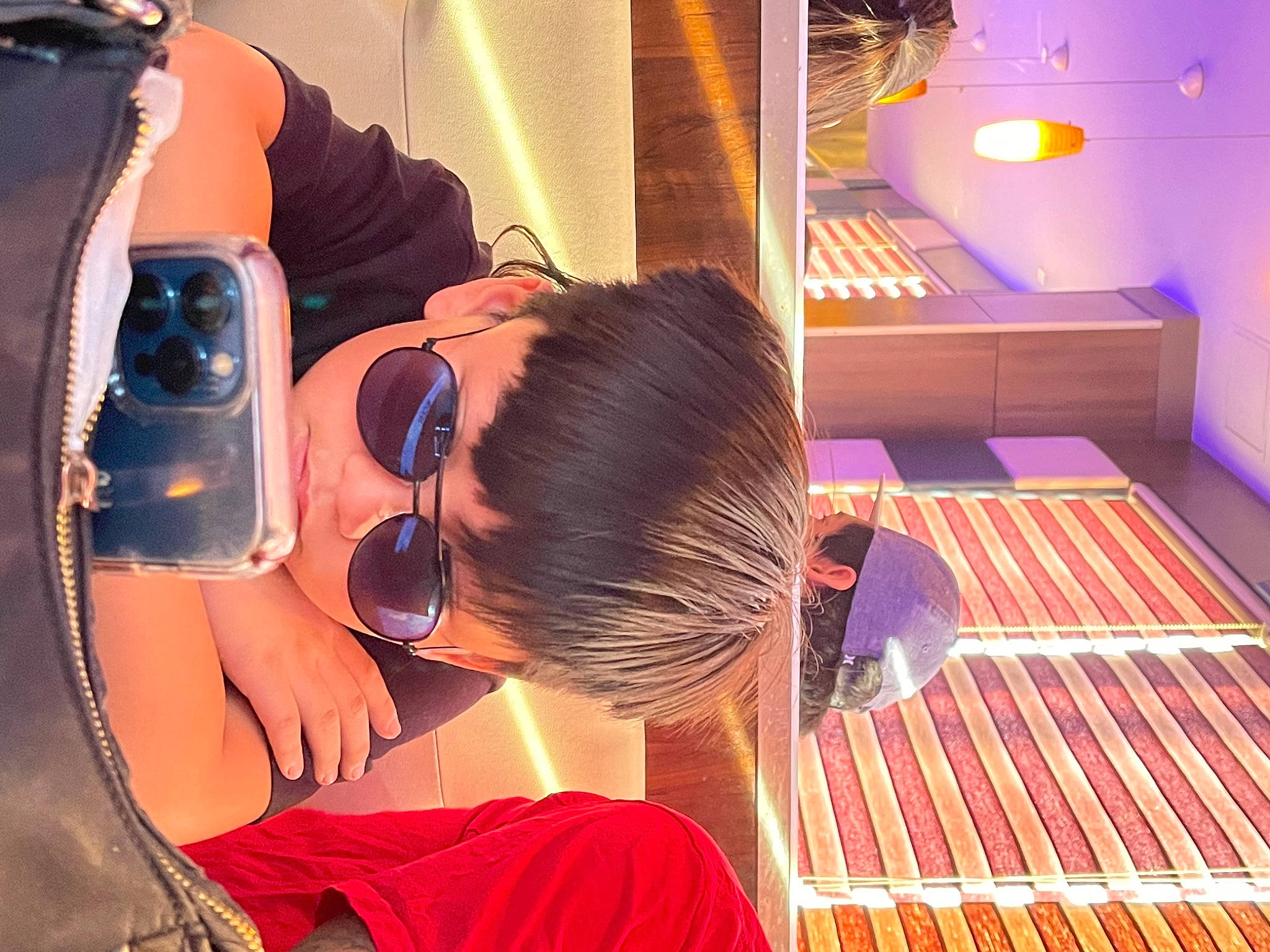 Chris Trevor Dela Cruz is registered to the contest to win money with this photo: audio_equipment, black_hair, child, comfort, elbow, event, eyewear, fun, goggles, hair_care, hair_coloring, leisure, magenta, person, personal_protective_equipment, room, service, sunglasses, t_shirt, vacation