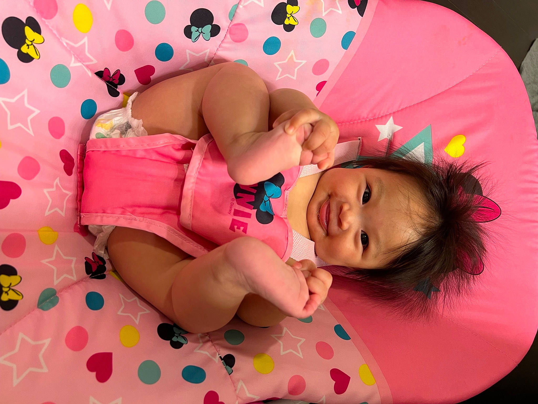 Amaiyah is registered to the contest to win money with this photo: arm, baby, baby_toddler_clothing, cheek, child, comfort, fun, happy, head, joy, linens, magenta, pattern, person, pink, play, skin, sleeve, smile, textile