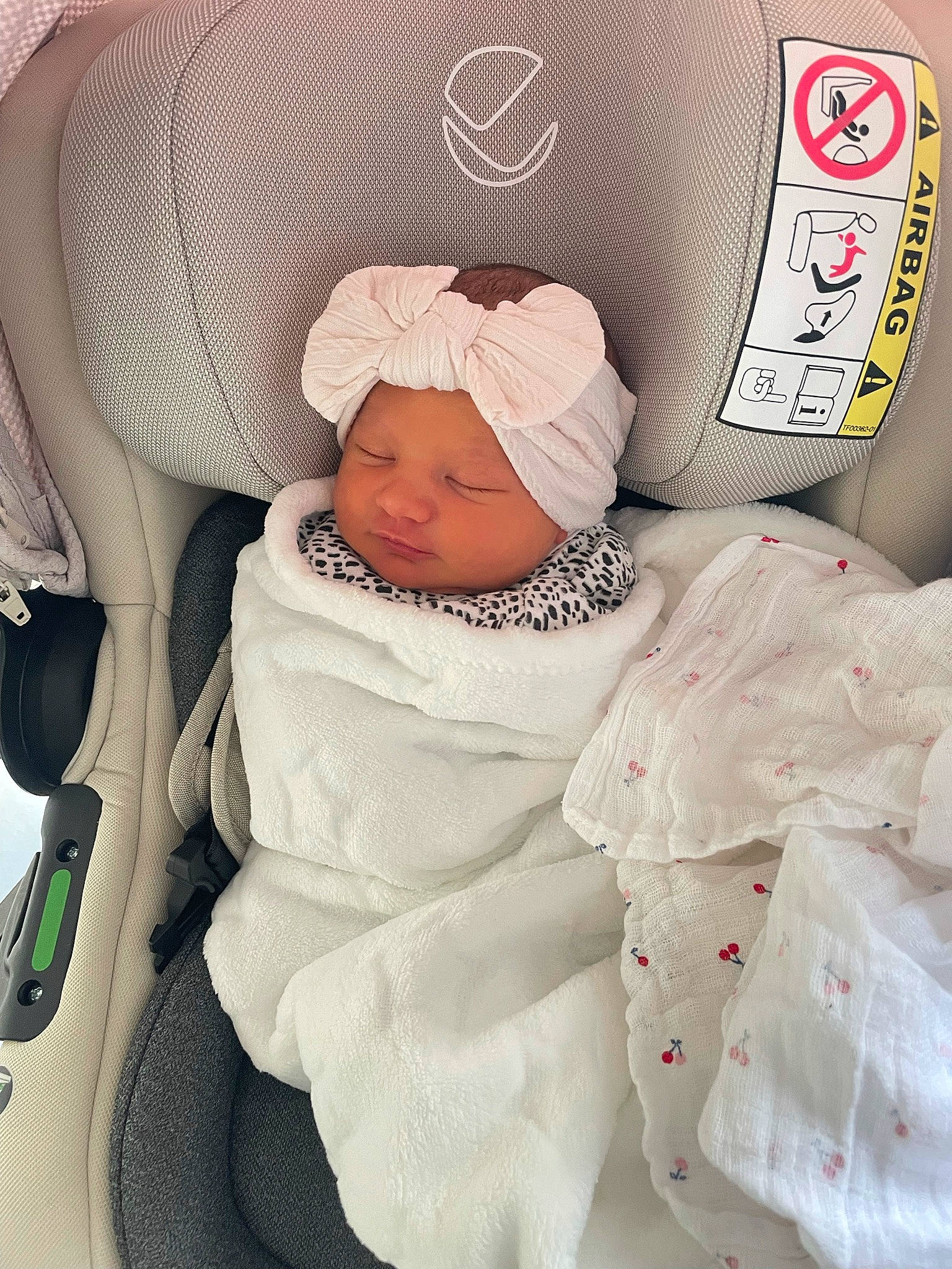 Bonnie is registered to the contest to win money with this photo: baby, baby_carriage, baby_in_car_seat, baby_products, baby_safety, baby_sleeping, baby_toddler_clothing, car_seat, child, comfort, font, headwear, infant_bed, linens, logo, pattern, peach, person, sitting, toddler