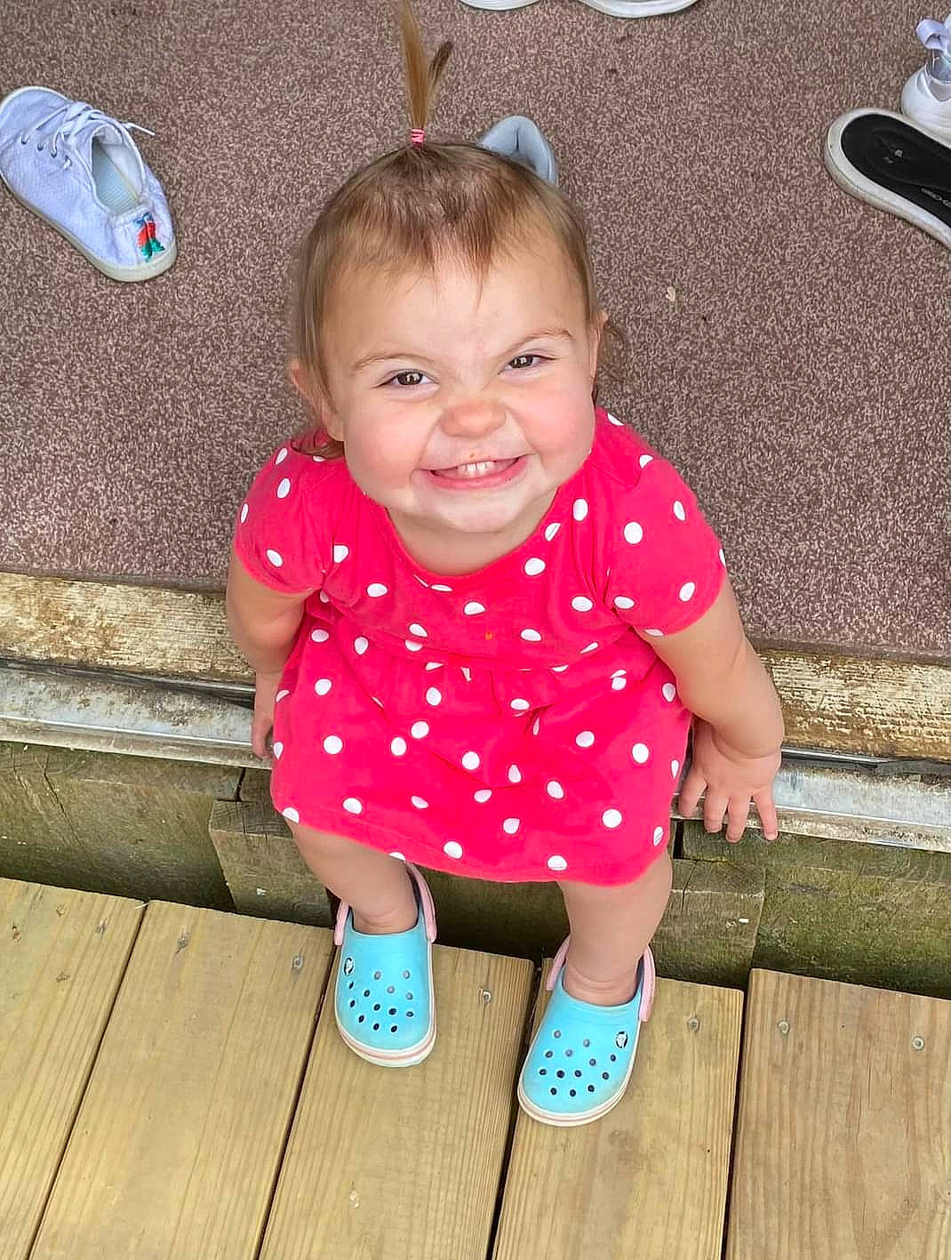 Kennedy joined the competition — help win amazing prizes! baby, baby_toddler_clothing, cheek, child, facial_expression, flooring, fun, grass, happy, joy, leisure, pattern, person, pink, sitting, skin, sleeve, smile, standing, toddler