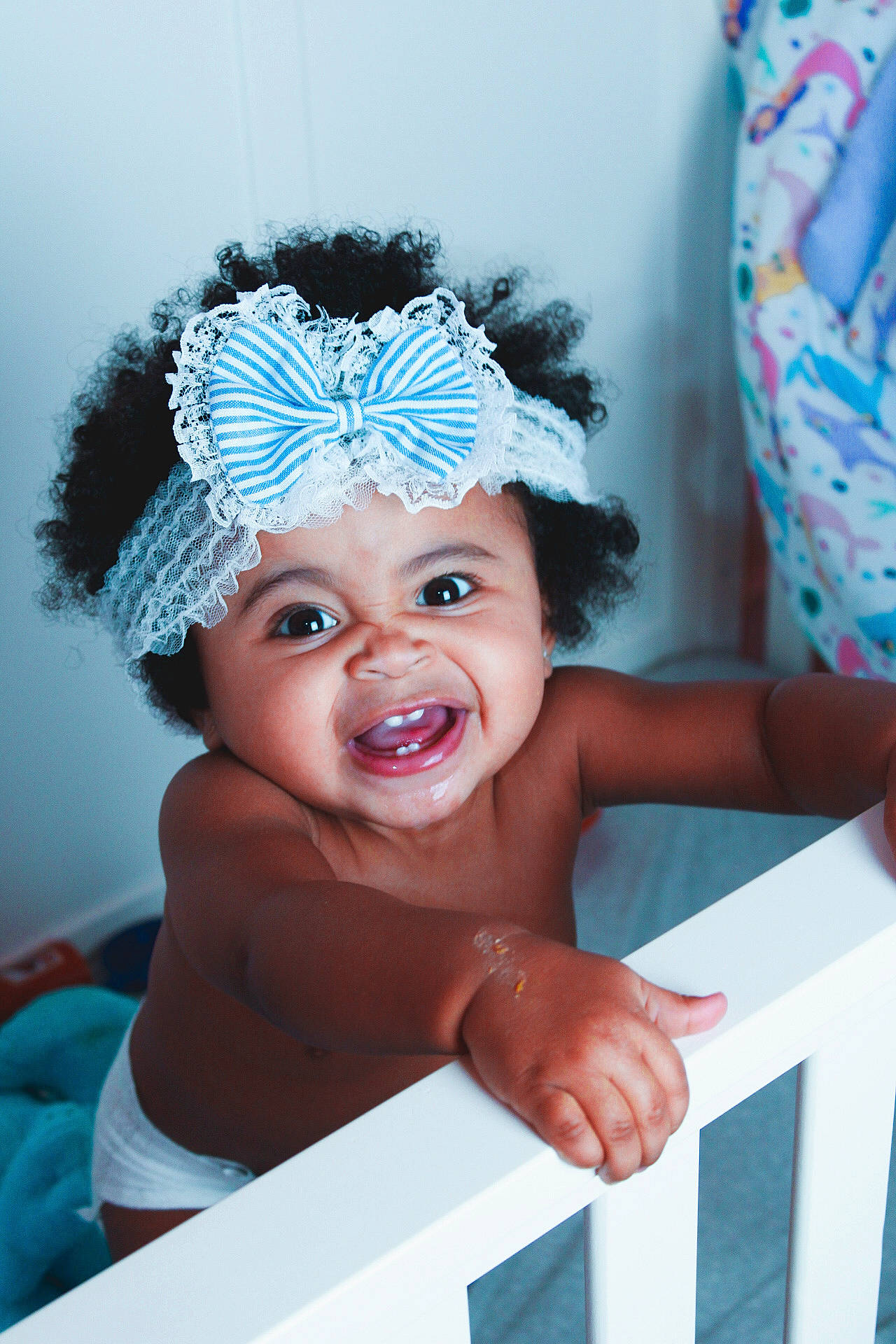 Stella joined the competition — help win amazing prizes! aqua, azure, baby, baby_laughing, baby_toddler_clothing, blue, child, electric_blue, eye, flash_photography, fun, happy, headgear, headpiece, headwear, leisure, person, pink, recreation, smile