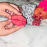 Saraphina is registered to the contest to win money with this photo: newborn, baby, sleeping, foot, hand, pink_bow, blanket, white, infant, cute, soft, toddler, person, portrait, clothing, patterned_outfit, cozy, rest, small, skin
