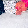 Saraphina is registered to the contest to win money with this photo: baby, sleeping, pink_bow, blanket, floral_outfit, infant, cute, peaceful, headband, soft, cozy, child, portrait, closeup, hands, face, newborn, resting, indoors, toddler