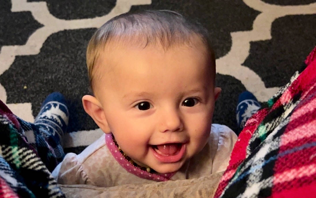 Mariah joined the competition — help win amazing prizes! baby, baby_laughing, baby_toddler_clothing, cheek, child, close_up, event, eyebrow, eyelash, face, fun, grass, happy, iris, lip, nose, person, sitting, skin, smile