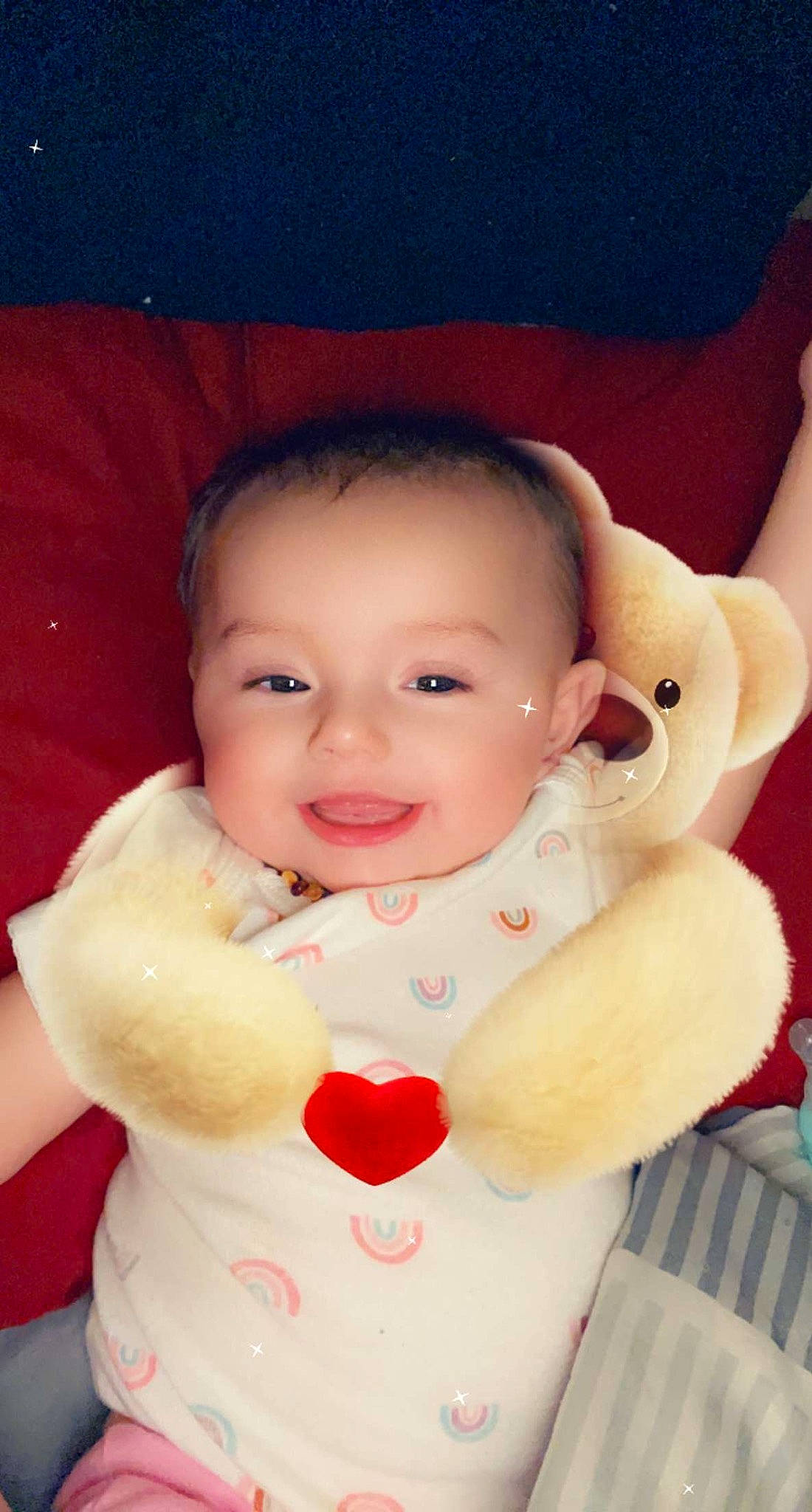 Mariah is registered to the contest to win money with this photo: arm, baby, baby_toddler_clothing, cheek, chin, eye, eyebrow, face, facial_expression, finger, gesture, hand, happy, head, joy, lip, mouth, nose, person, pink