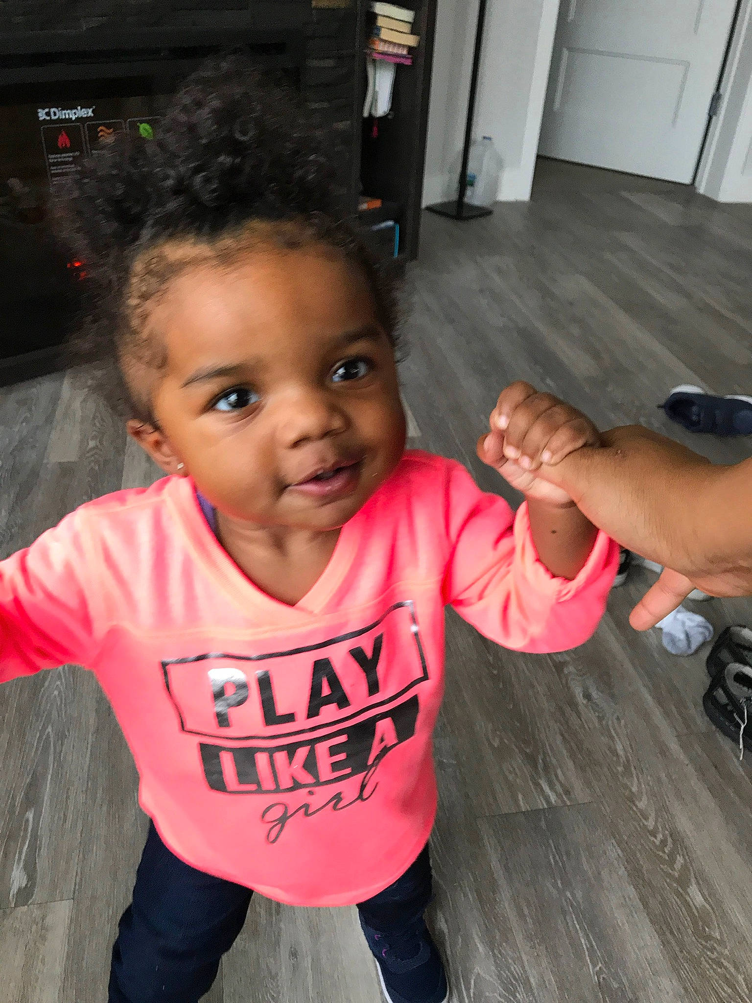 Monet is registered to the contest to win money with this photo: arm, baby_toddler_clothing, cheek, child, cool, fun, gesture, hairstyle, hand, happy, joint, leisure, mouth, nose, person, skin, sleeve, t_shirt, thumb, toddler