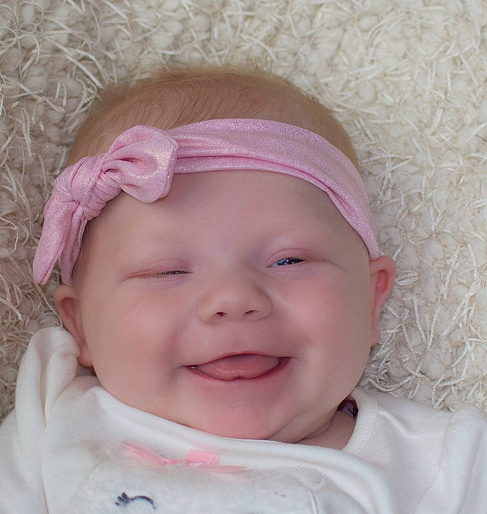 Bria joined the competition — help win amazing prizes! baby, baby_making_funny_faces, cheek, child, chin, eyebrow, face, facial_expression, forehead, hair_accessory, head, headband, headgear, joy, lip, mouth, nose, person, pink, skin