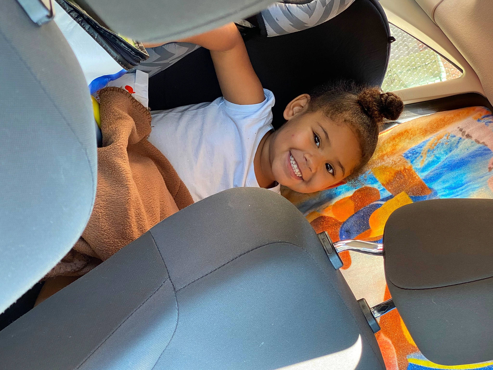 Violet is registered to the contest to win money with this photo: auto_part, automotive_design, automotive_exterior, automotive_tire, bumper, car, car_seat, car_seat_cover, comfort, facial_expression, fun, gesture, happy, hood, joy, leisure, motor_vehicle, person, product, shorts