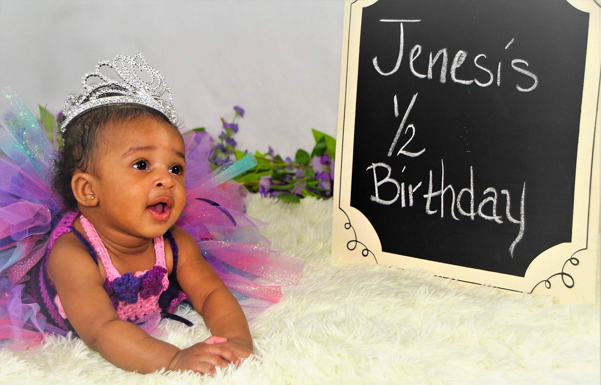 Jenesis is registered to the contest to win money with this photo: baby, baby_toddler_clothing, beauty, blackboard, cap, chalk, face, font, handwriting, happy, headpiece, person, petal, photograph, pink, product, purple, rectangle, snapshot, toddler