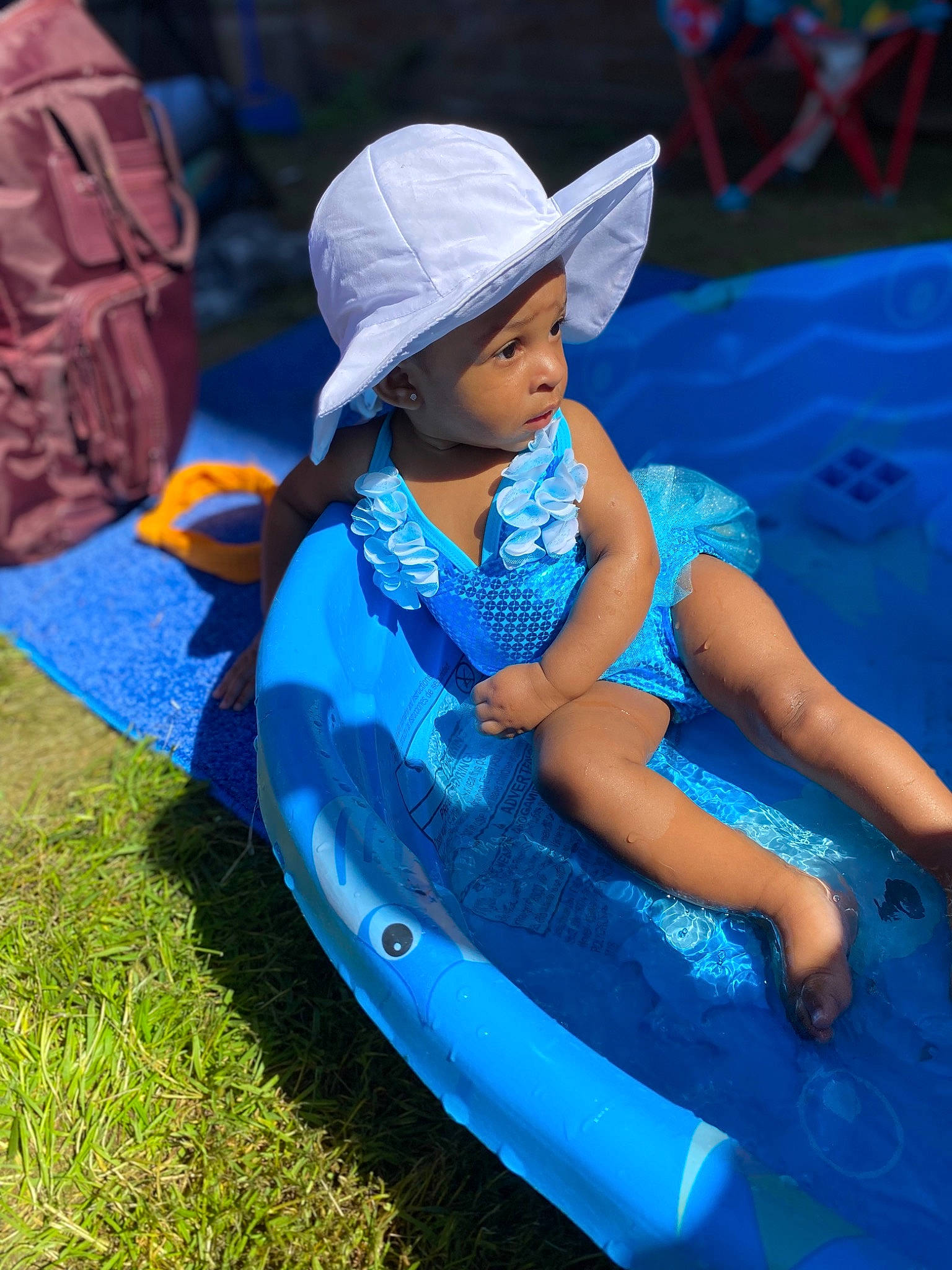 Jenesis joined the competition — help win amazing prizes! azure, baby, baseball_cap, boats_and_boating_equipment_and_supplies, cap, child, electric_blue, fashion_accessory, fun, grass, happy, hat, headwear, leisure, outdoor_play_equipment, person, play, product, recreation, sitting
