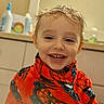 Ariakus is registered to the contest to win money with this photo: background, bathroom, bottle, cabinet, cartoon, child, clothing, countertop, cute, face, happy, indoor, light, person, portrait, robe, smiling, spiderman, wet_hair, young_child