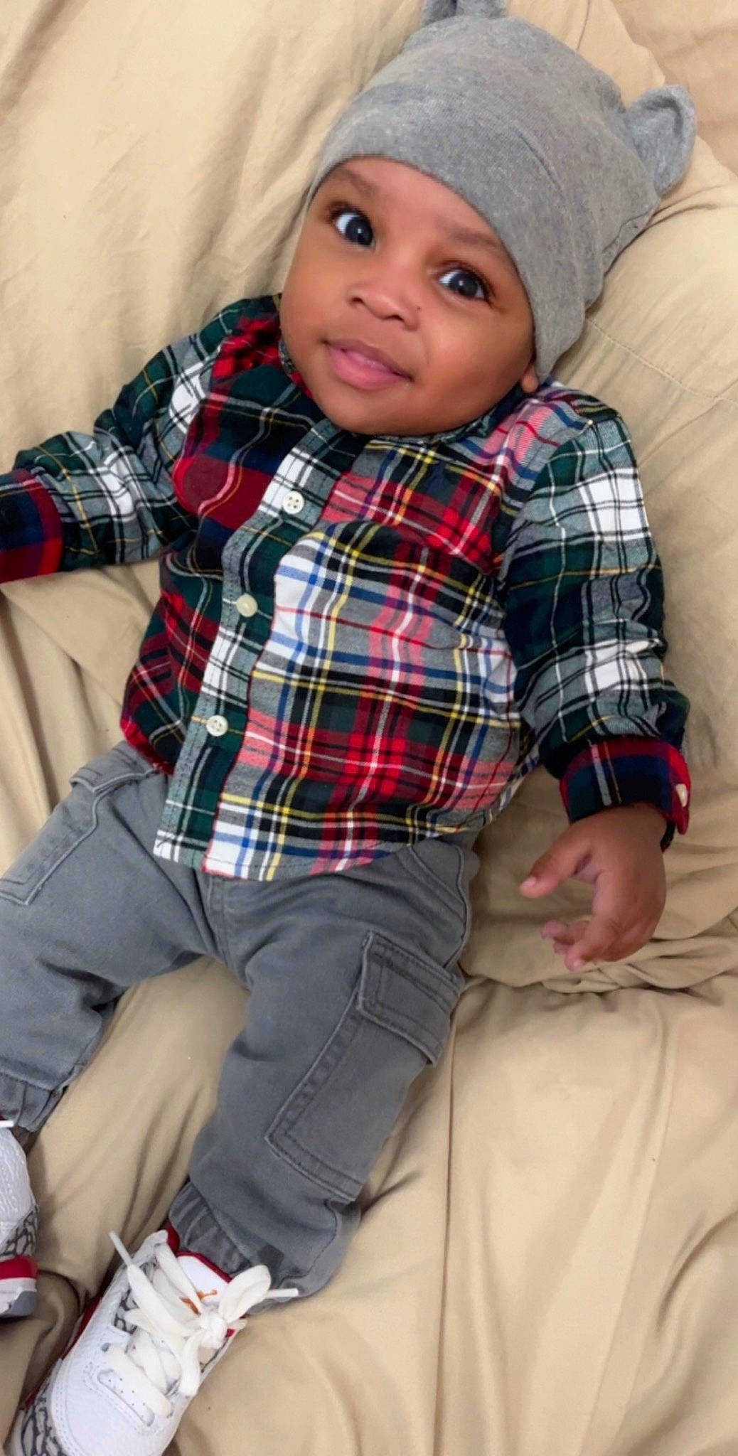 Harlem is registered to the contest to win money with this photo: collar, comfort, cool, dress_shirt, face, fashion, flash_photography, headwear, jeans, outerwear, pattern, person, pink, plaid, purple, sleeve, t_shirt, tartan, textile, toddler