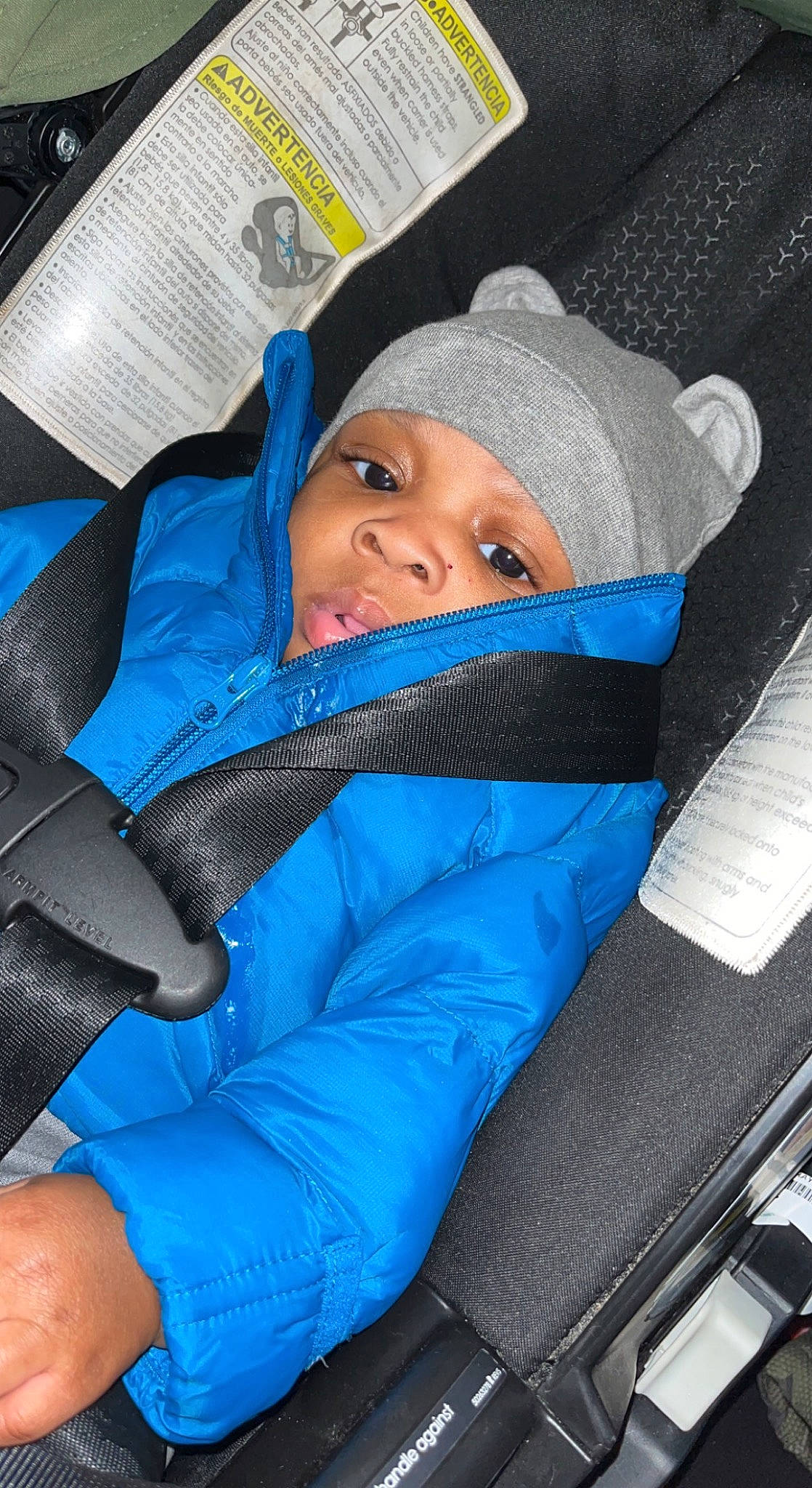 Harlem joined the competition — help win amazing prizes! baby, blue, car_seat, child, comfort, electric_blue, fun, head_restraint, headwear, person, sitting, smile, toddler, travel