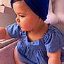 adorable, baby, blue_dress, blue_headband, child, closeup, curious, cute, foot, hand, heart_pattern, indoor, infant, person, pink_cushion, portrait, sitting, skin, soft_light, toddler