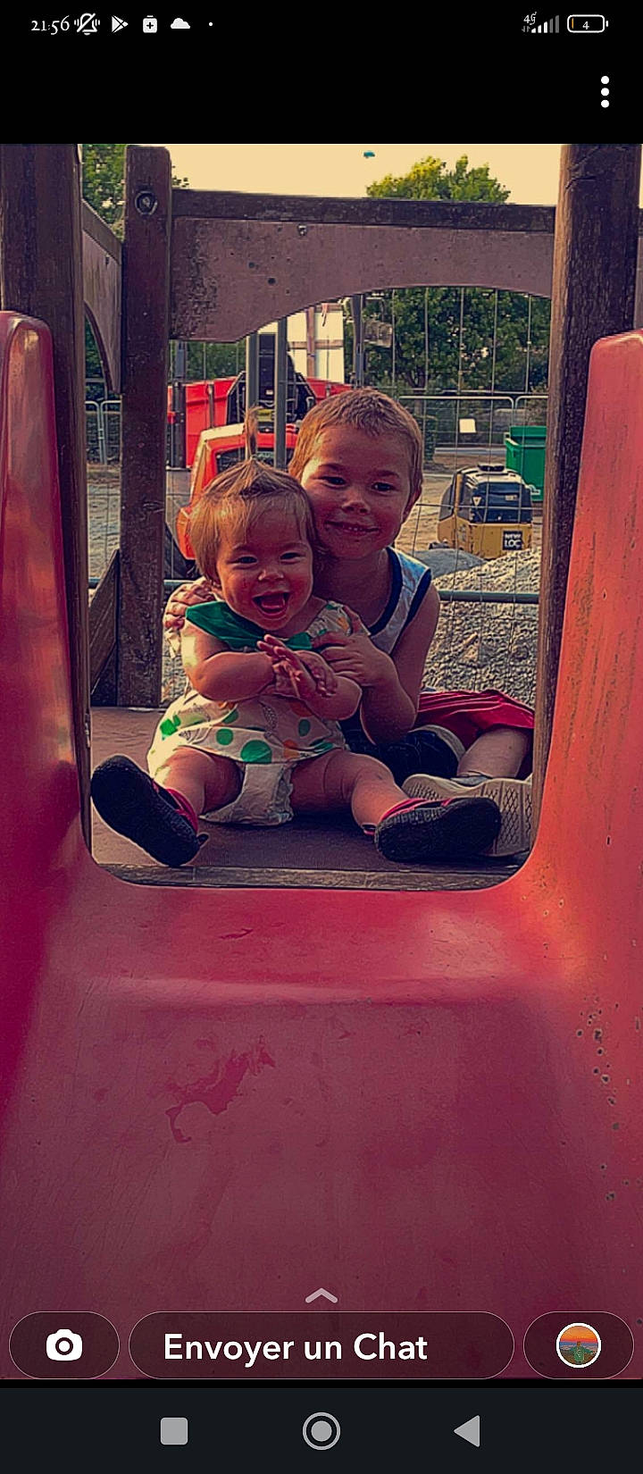 Thya participe au concours pour gagner de l'argent avec cette photo : baby, baby_toddler_clothing, child, city, dress, fun, happy, joy, leisure, magenta, motor_vehicle, outdoor_play_equipment, person, pink, playground, playground_slide, recreation, shorts, smile, t_shirt