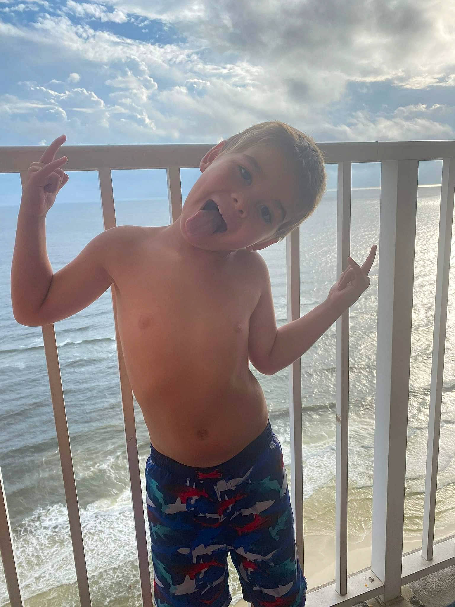 Ayden joined the competition — help win amazing prizes! azure, barechested, chest, cloud, elbow, gesture, happy, human_body, muscle, person, shorts, shoulder, sky, thigh, thumb, toddler, travel, trunk, trunks, waist
