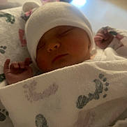 Kacie joined the competition — help win amazing prizes! newborn, baby, sleeping, blanket, hat, infant, cozy, footprints, soft, cute, peaceful, indoors, wrapped, child, portrait, resting, warm_light, closeup, face, adorable