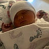 newborn, baby, sleeping, blanket, hat, infant, cozy, footprints, soft, cute, peaceful, indoors, wrapped, child, portrait, resting, warm_light, closeup, face, adorable