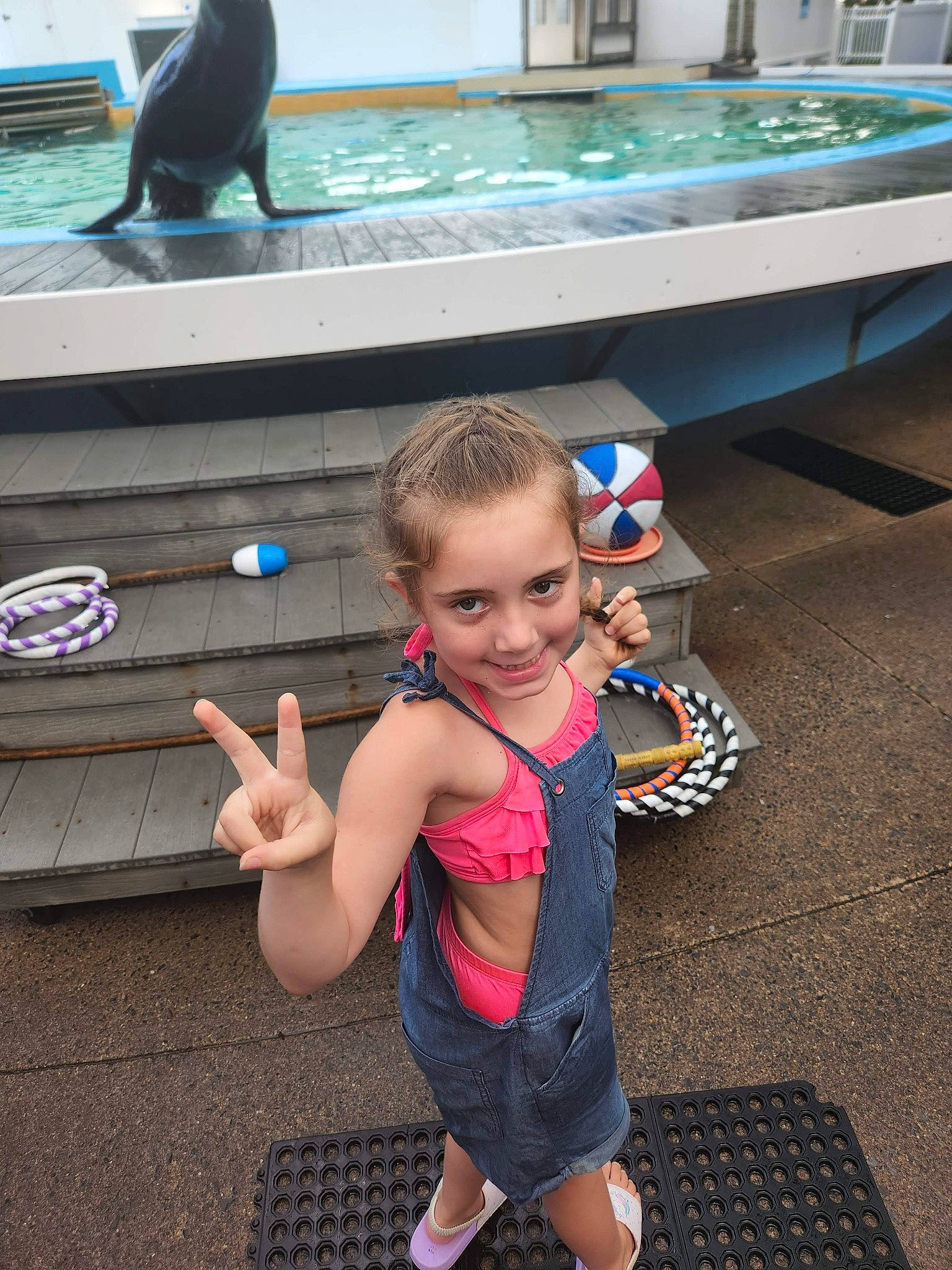 Brooke joined the competition — help win amazing prizes! baby, child, event, face, finger, fun, gesture, happy, joy, leisure, mammal, person, recreation, shorts, smile, snapshot, standing, t_shirt, thumb, toddler