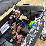 Dutchess joined the competition — help win amazing prizes! accessory, baby, camo_pattern, child, clothing, cute, footwear, headband, outdoor, pacifier, pavement, person, plastic_cup, plaything, seatbelt, stroller, sunglasses, toddler, toy, wheel